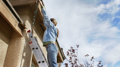woman setting up lights