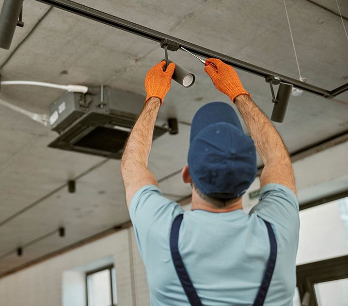 man setting up light bulb